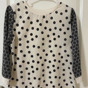 White blouse with black dots and sleeves